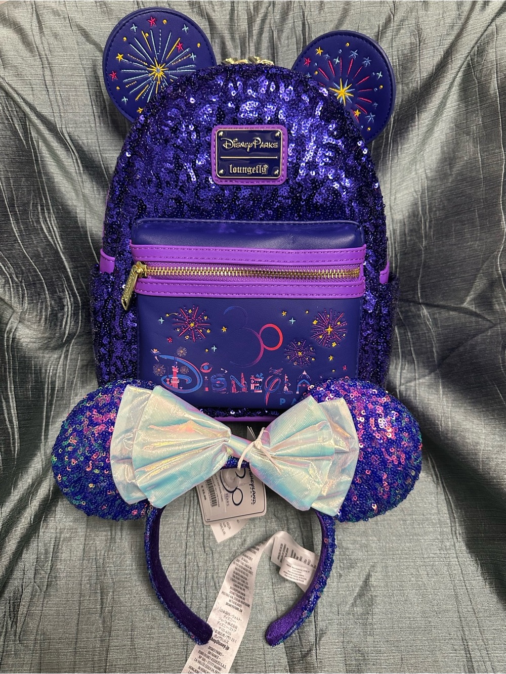 Loungefly Disneyland Paris 30th Purple Sequin Fireworks Mini Backpack & Bow Ears